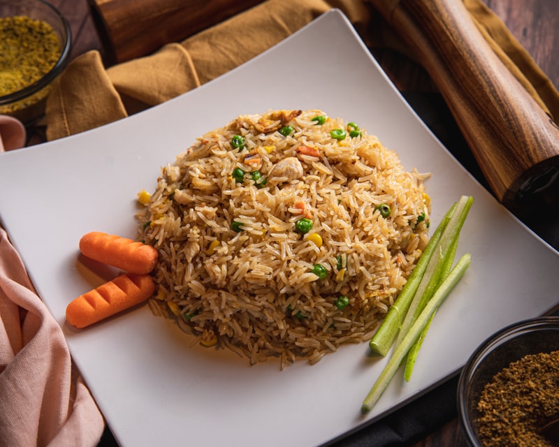 Chicken chilli stir-fried with capsicum and onion, served with rice
